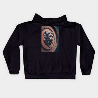 A decorative door knocker shaped like a lion's head Kids Hoodie